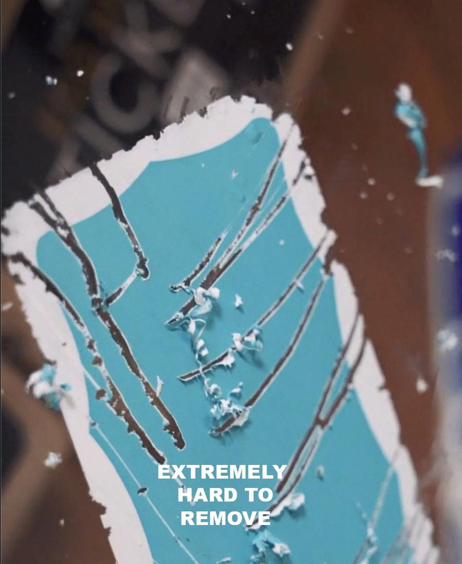 An EggShell sticker mid-peel - the shell layer cracking apart